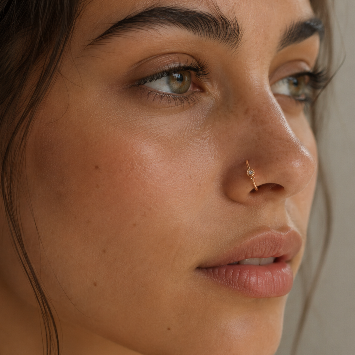 Diamond gold nose hoop worn on the nose