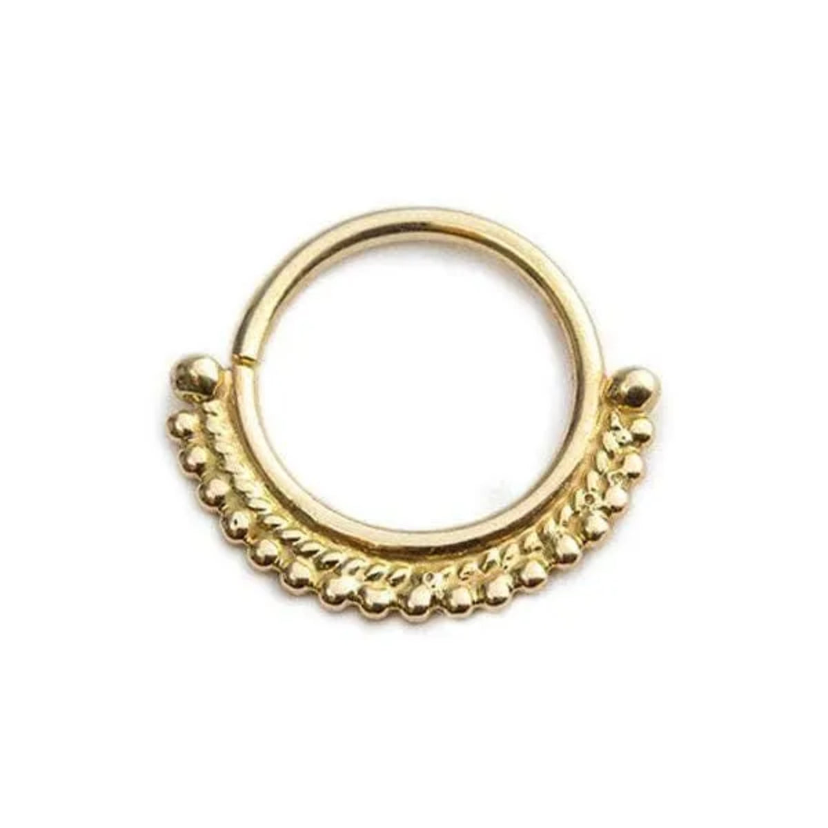 A gold-colored metal ring with a decorative design on the surface.
