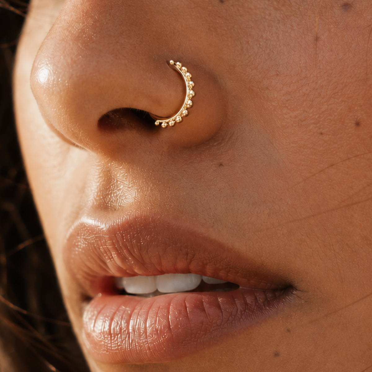 A close-up of a person's face, focusing on their nose and mouth area.