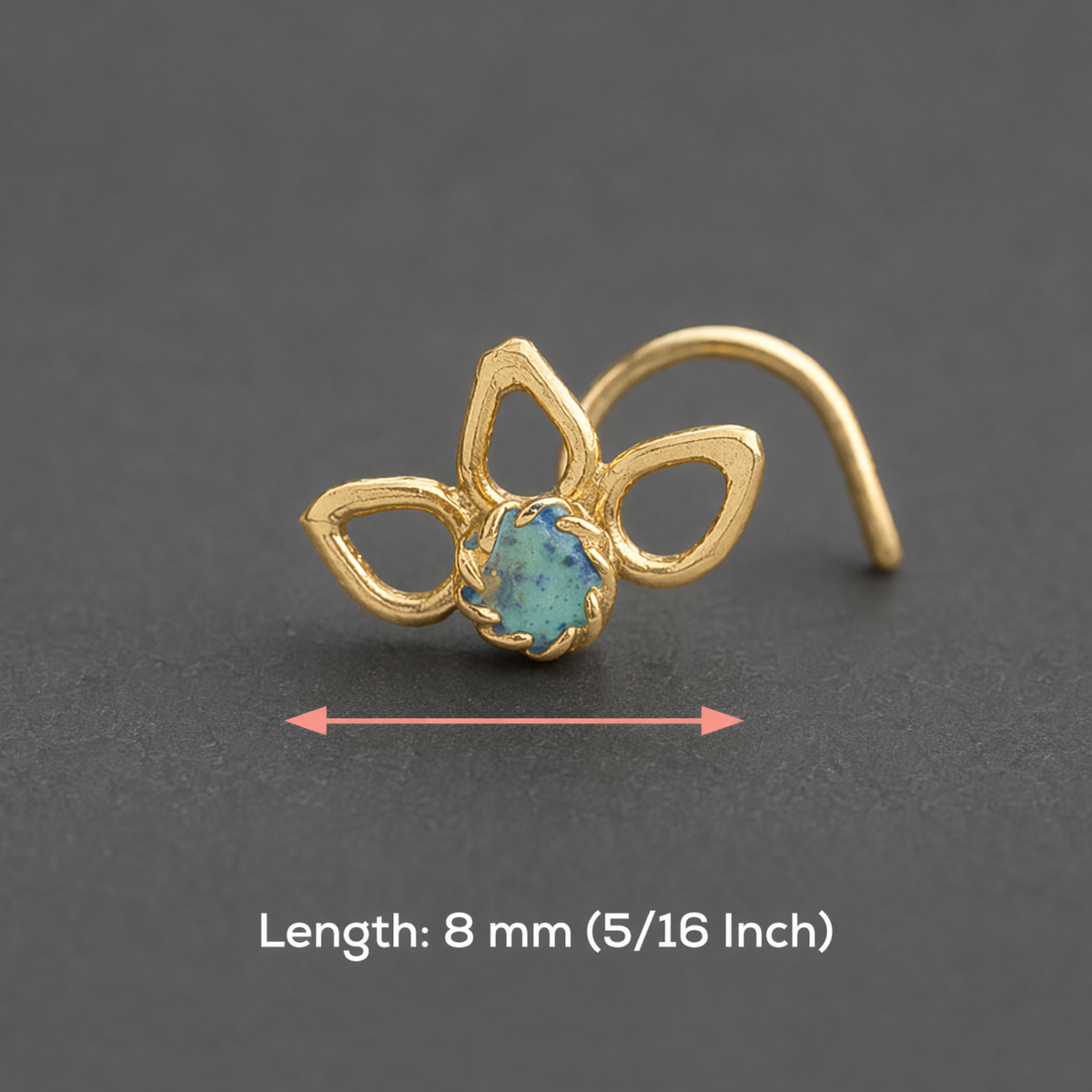 A gold-colored nose ring with a blue gemstone is shown on a gray background, accompanied by a measurement indicating its length is 8 millimeters (5/16 inch).