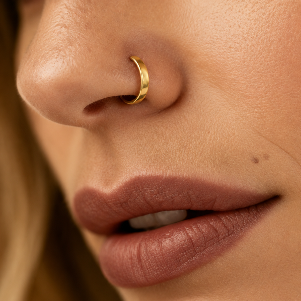 A close-up of a person's face, focusing on their lips and nose.