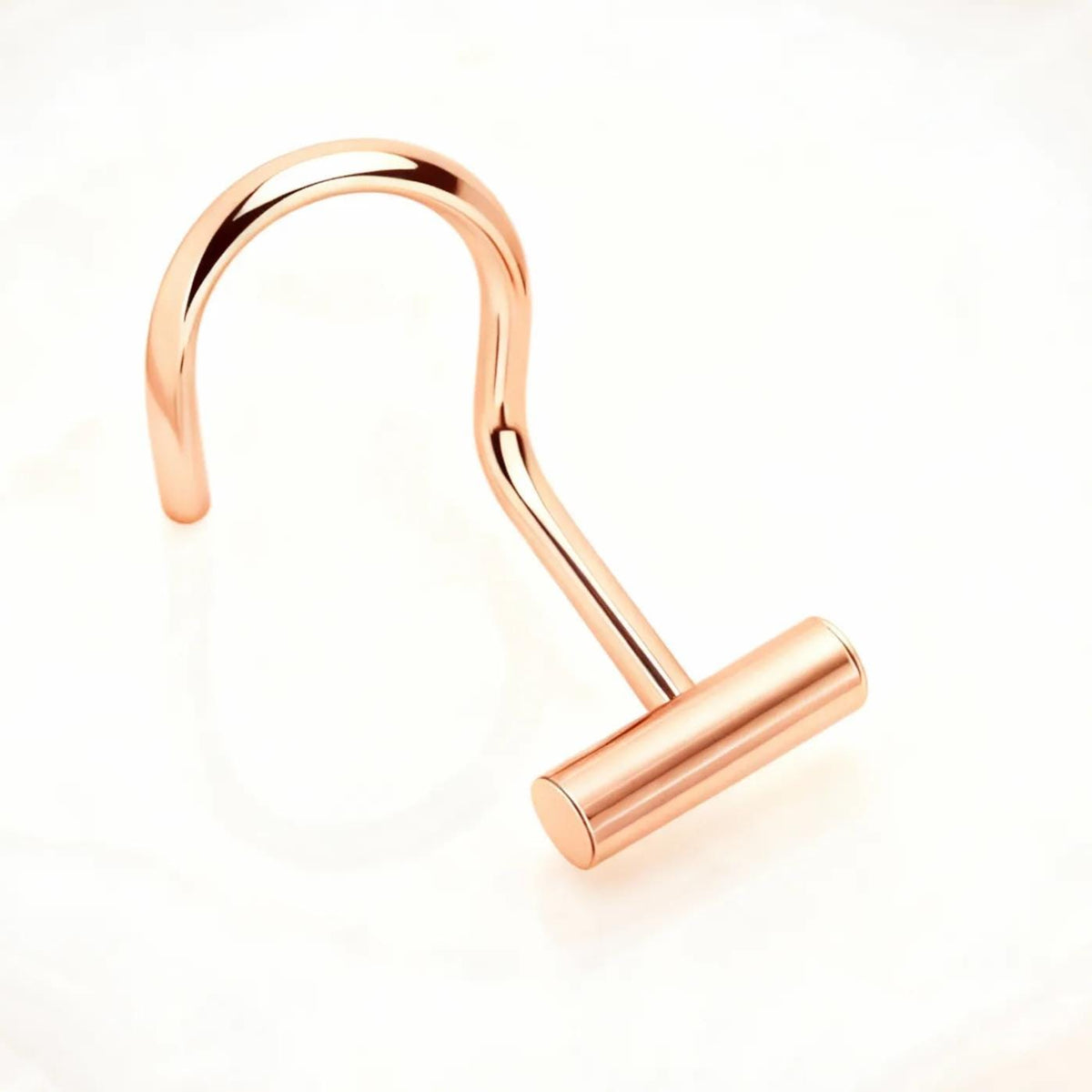 A shiny, metallic hook or hanger with a curved, metallic shape is shown against a plain white background.
