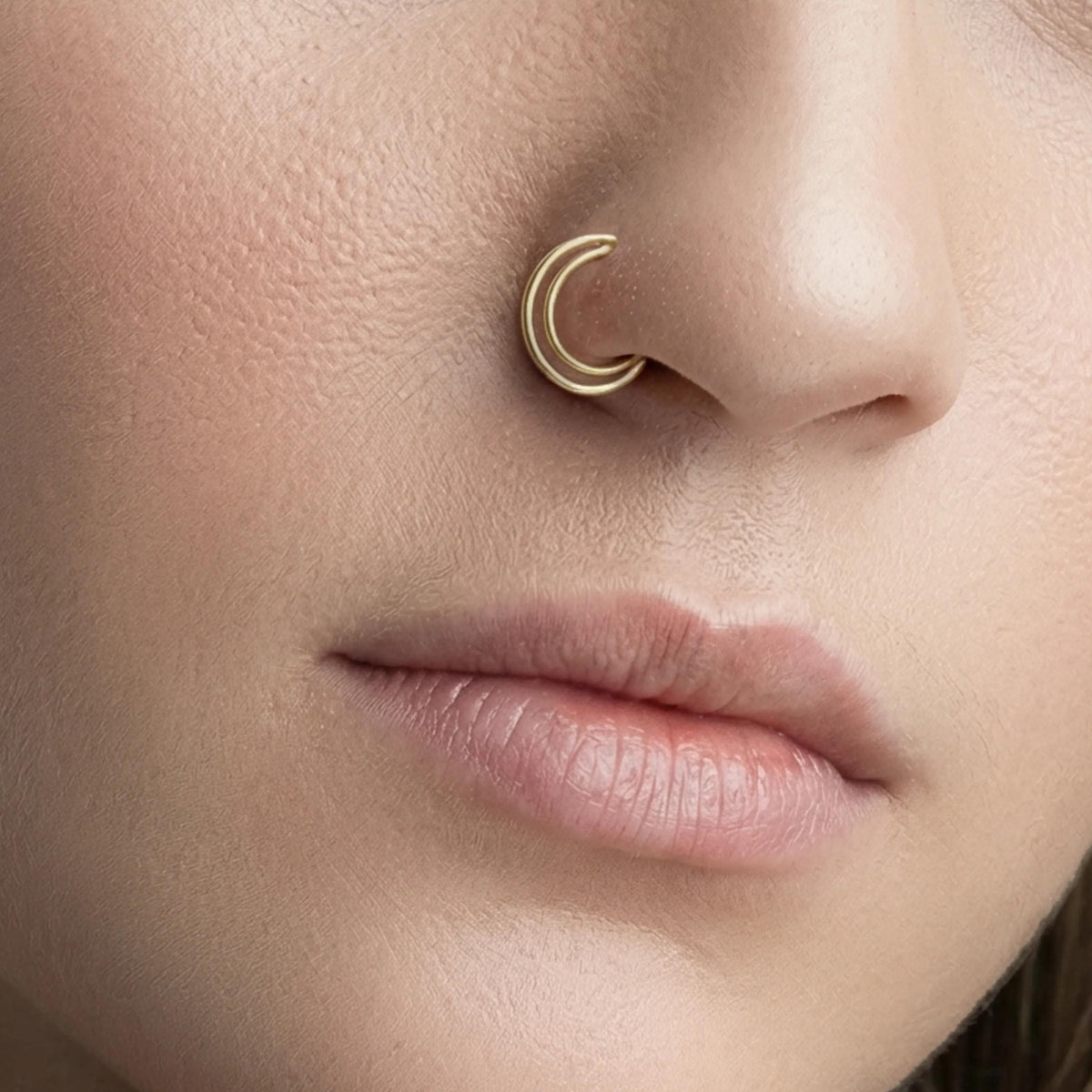 A close-up of a person's face, focusing on their nose and chin area.