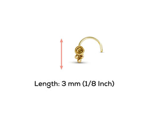 a gold-colored nose stud with a measurement scale indicating its length.