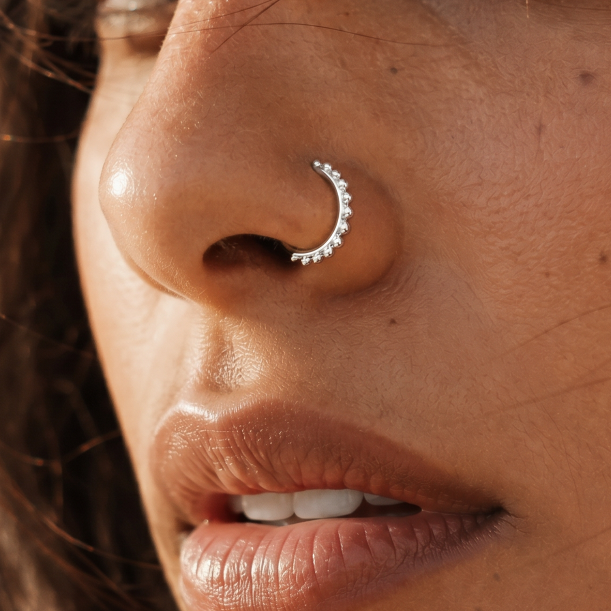 A close-up of a person's face, focusing on their nose and mouth area.