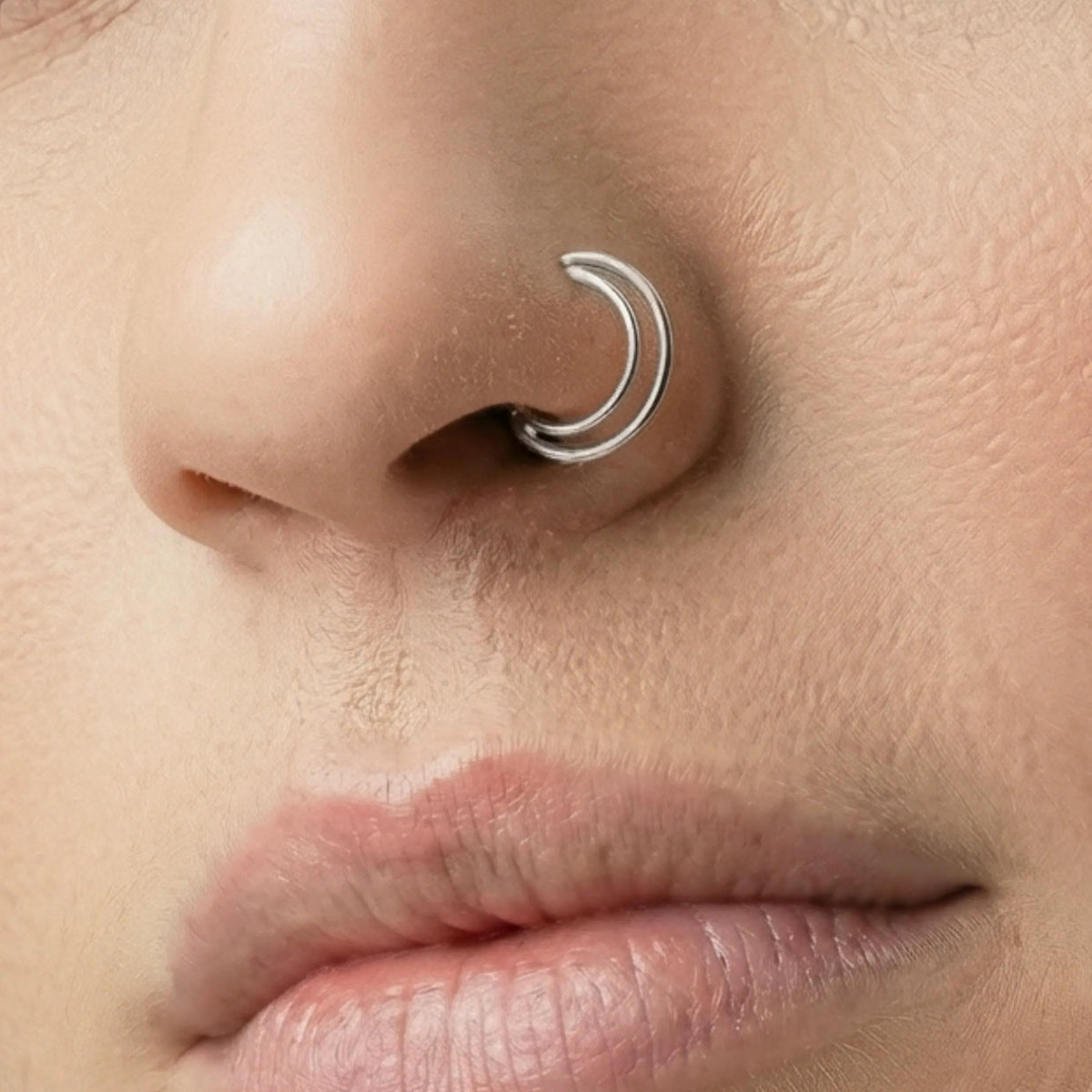 A close-up of a person's face, focusing on their nose and lips.