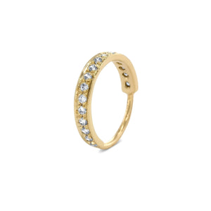 A gold ring with a row of small diamonds along its length.