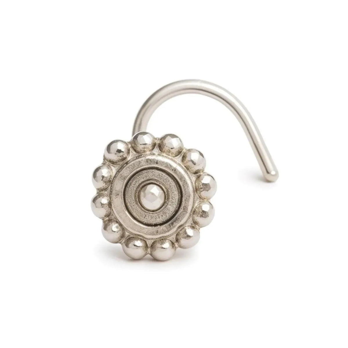 A silver-colored metal nose ring with a decorative design on the front.