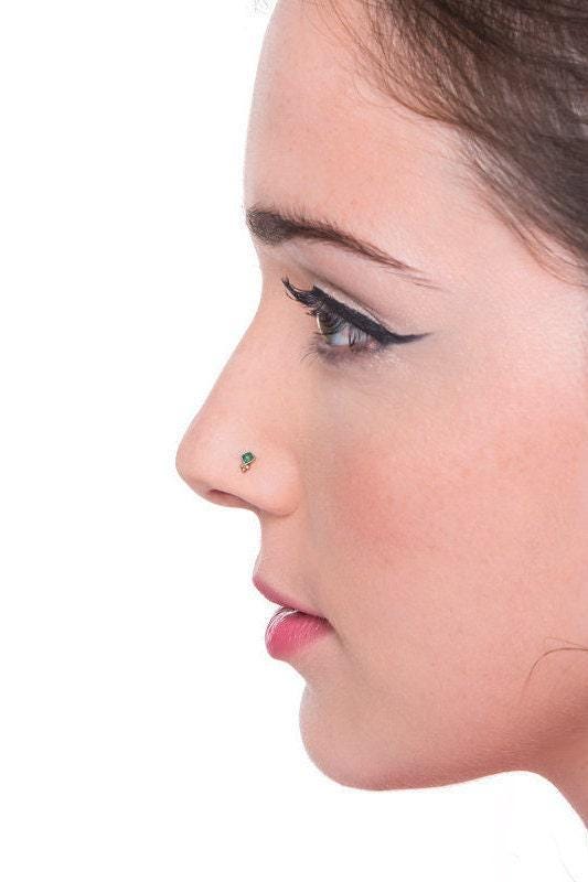A close-up profile view of a woman's face, focusing on her nose and lips.