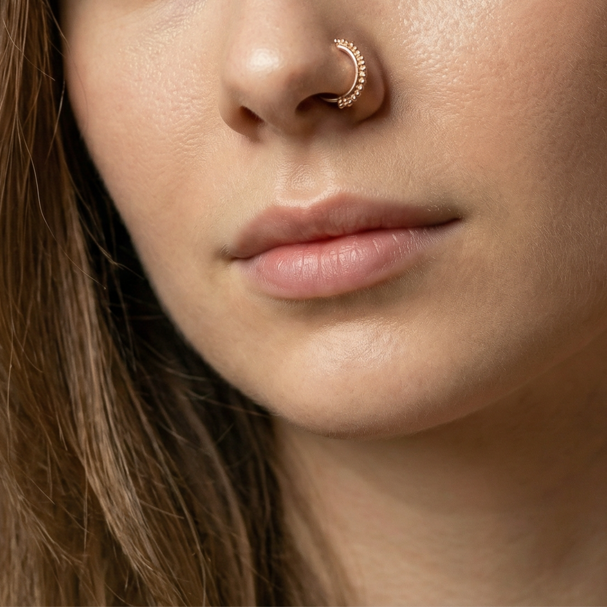A close-up of a person's face, focusing on their nose and mouth area.