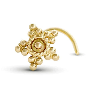 A gold-colored nose ring with a star-shaped design and small round beads.