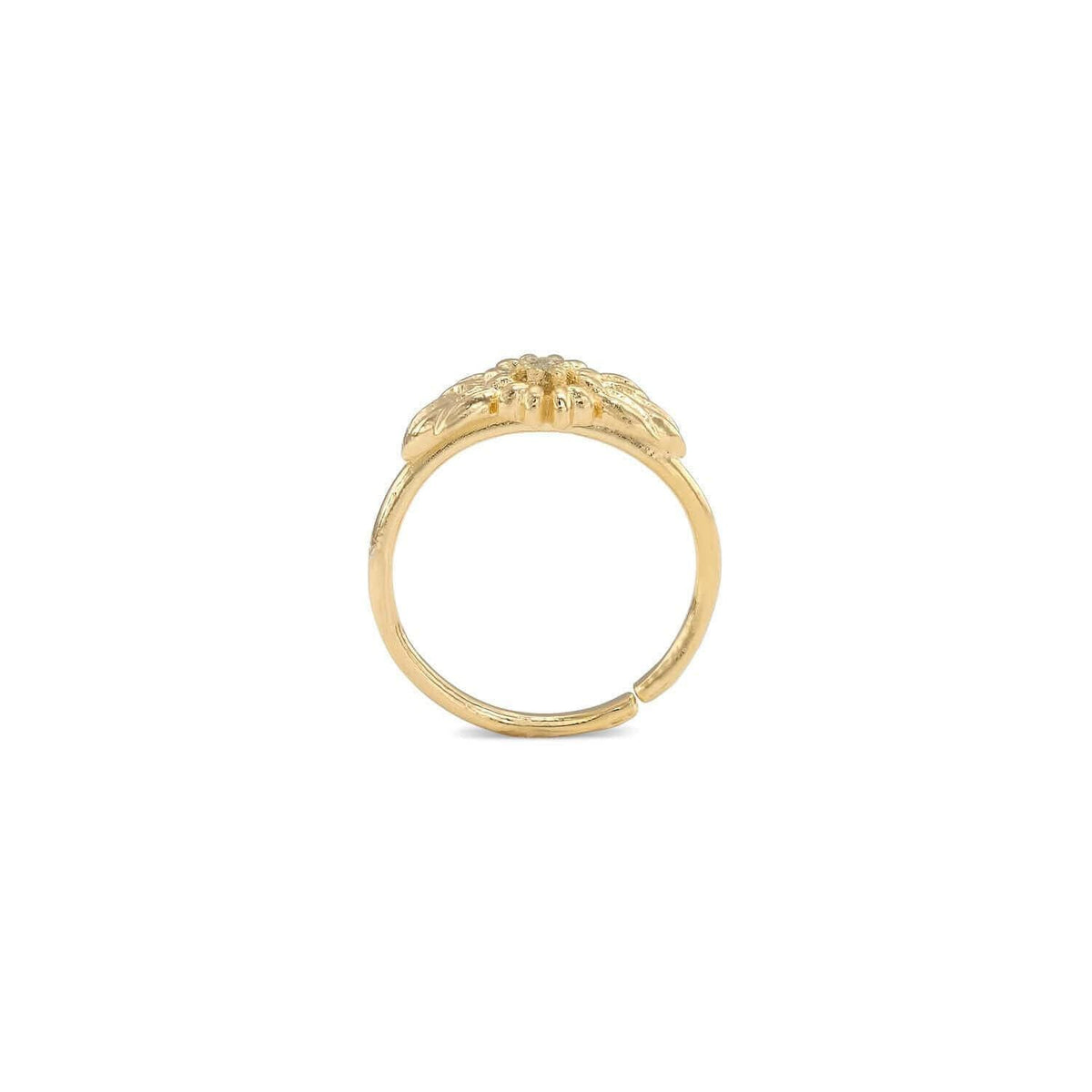 A gold ring with a floral design on the top half.