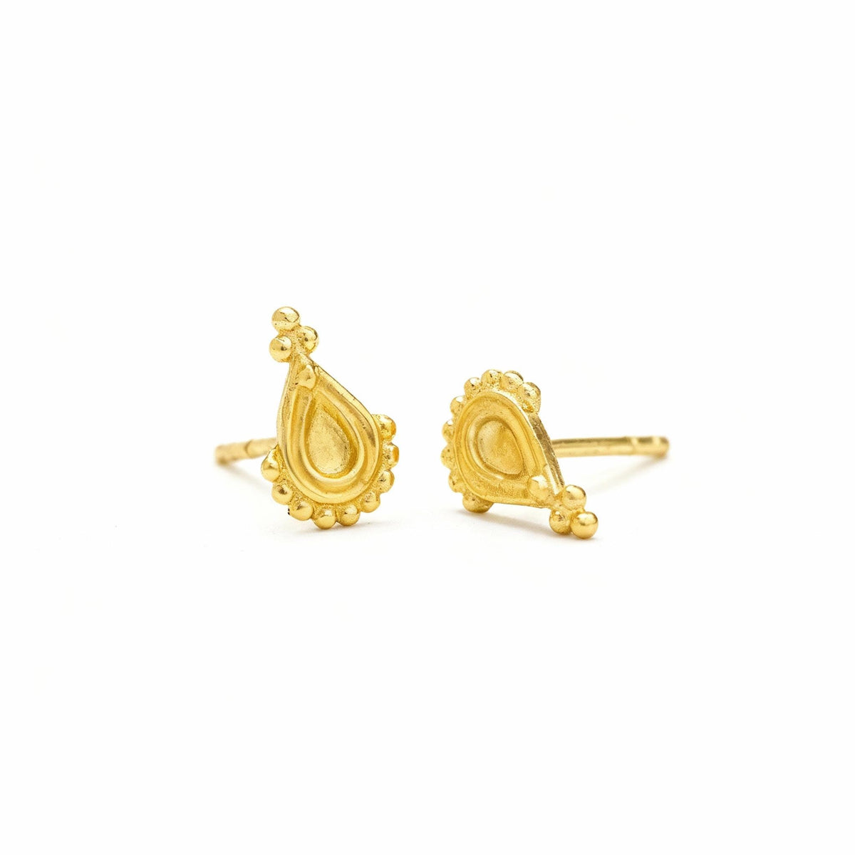 a pair of gold earrings with intricate designs, including a teardrop-shaped pendant and a smaller, rounder pendant.