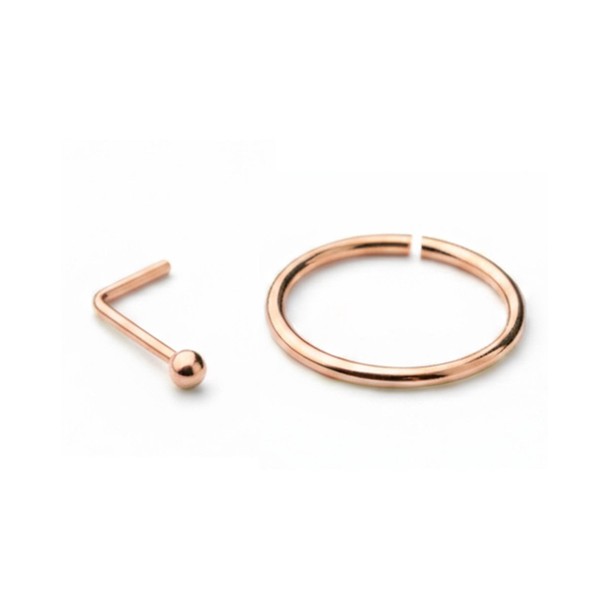 a small copper-colored nose ring and a small copper-colored ring on a white background.