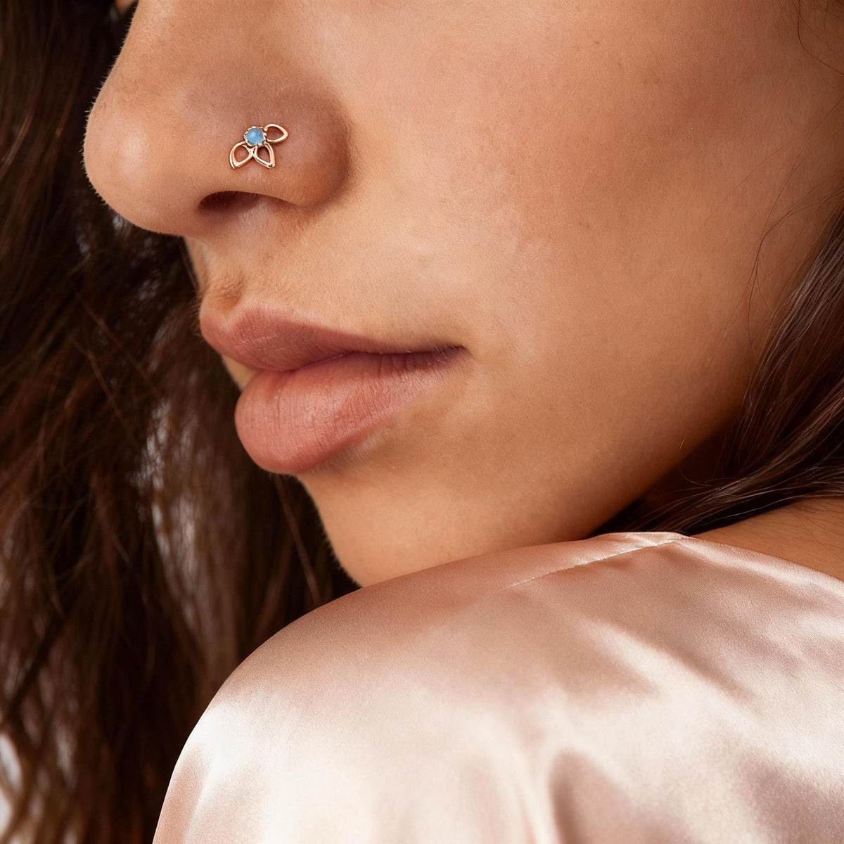 A close-up of a person's face, focusing on their nose and chin area.