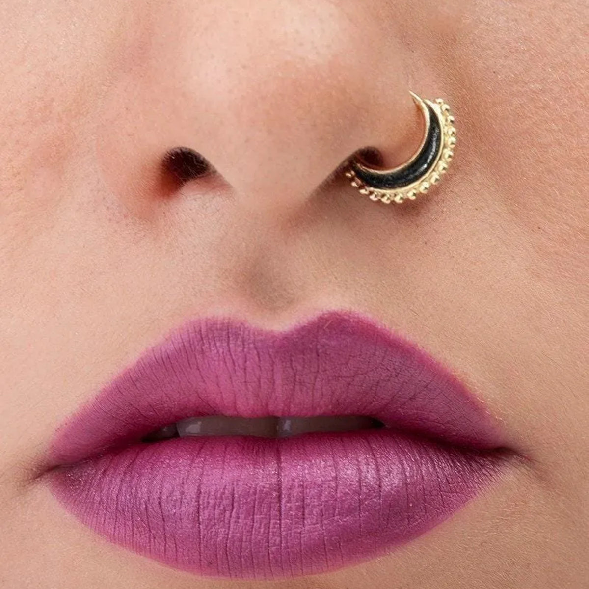 Indian Nose Ring: A close-up of a person's face, focusing on their lips and nose.