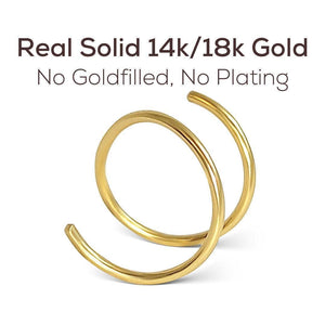 a pair of gold rings with a caption stating that they are real solid 14k/18k gold, without any fillers or plating.