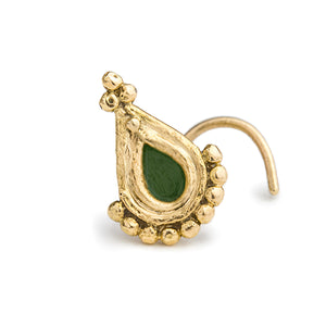 A gold-colored nose ring with a green gemstone in the center.