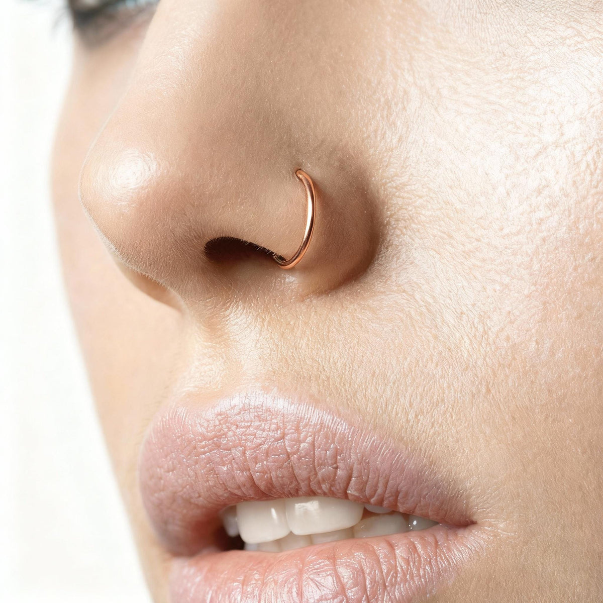 A close-up of a person's face, focusing on their nose and mouth area.