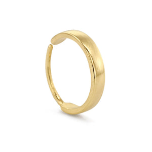 A gold ring with a curved band is shown against a white background.