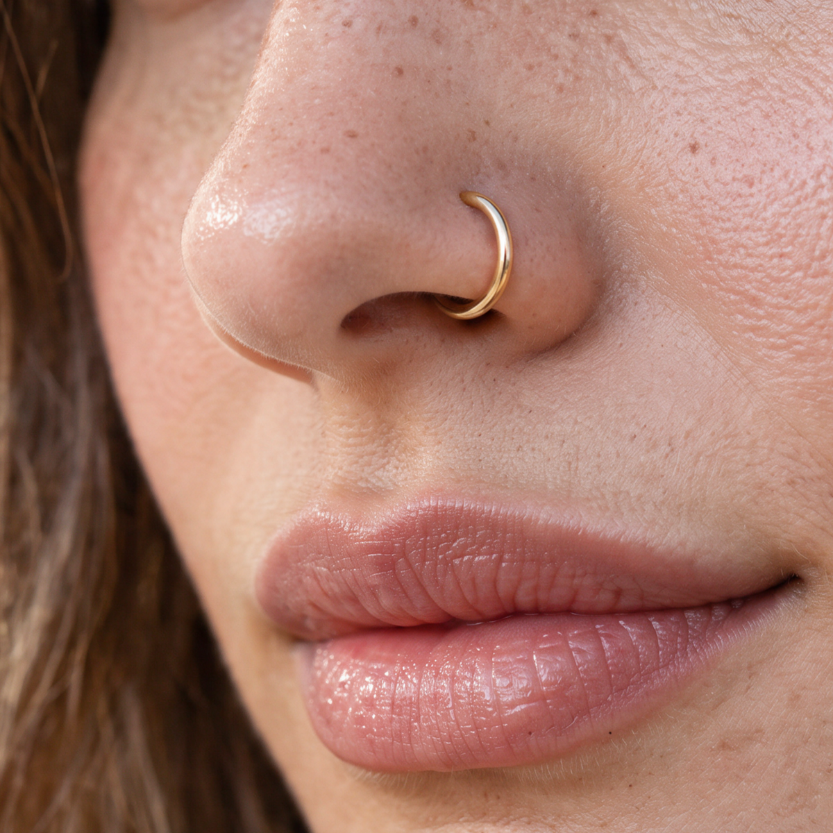 A close-up of a person's face, focusing on their nose and lips.