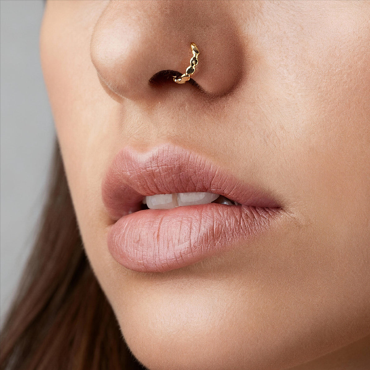A close-up of a person's face, focusing on their lips and nose.