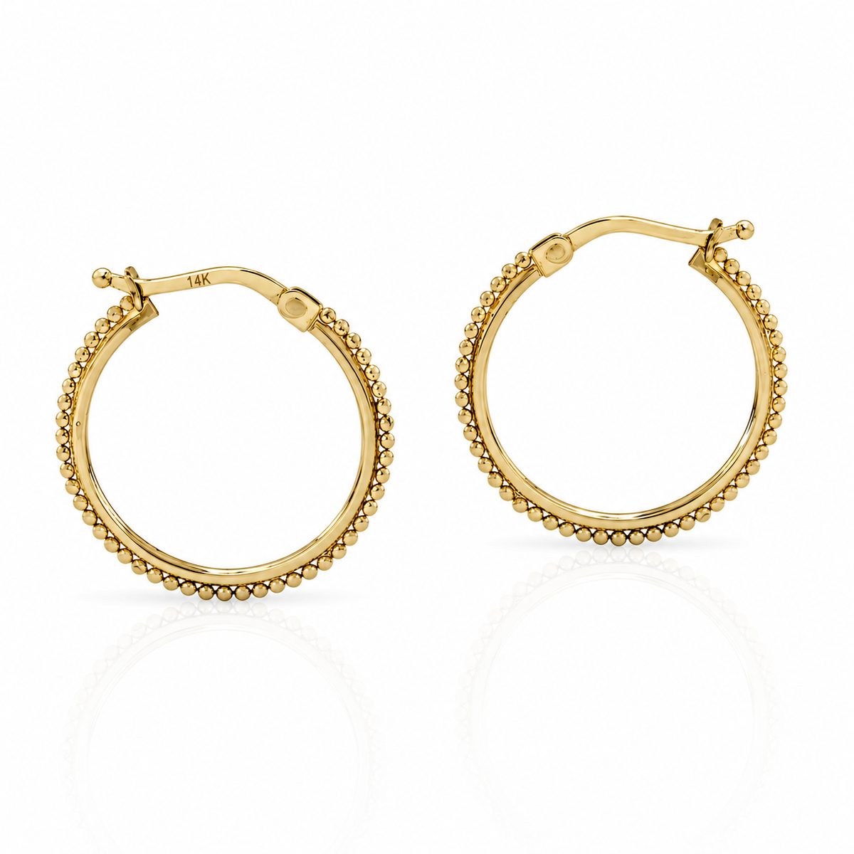 A pair of gold hoop earrings with a textured, beaded design.