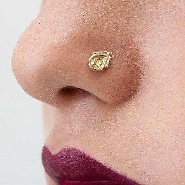 A close-up of a person's face, focusing on their nose and lips.
