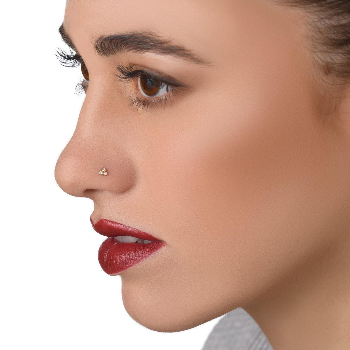A close-up of a woman's face, focusing on her lips and nose.