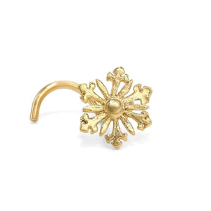 A gold-colored metal nose ring with an intricate, snowflake-like design.