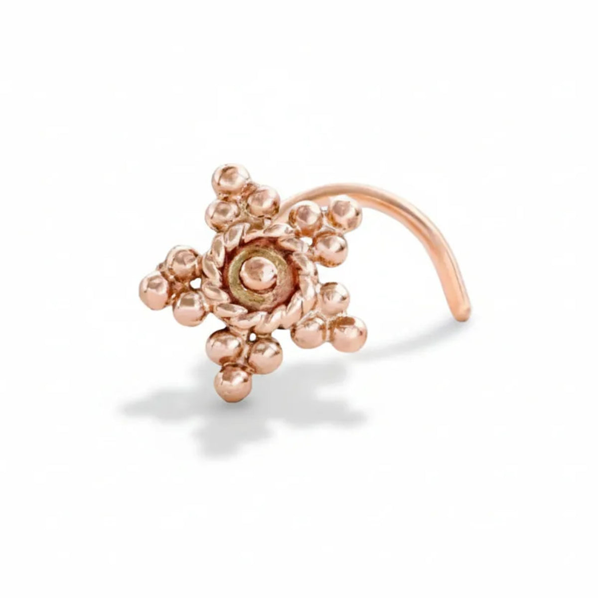 Tribal Star Nose Stud: A copper-colored metal nose ring with a star-shaped design and small beads or stones.
