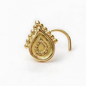Indian Style Nose Stud: A gold-colored nose stud with a decorative design on the front.