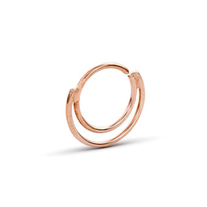 A single, circular gold-colored ring with a twisted design.