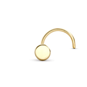 A gold-colored nose ring with a round, polished surface.