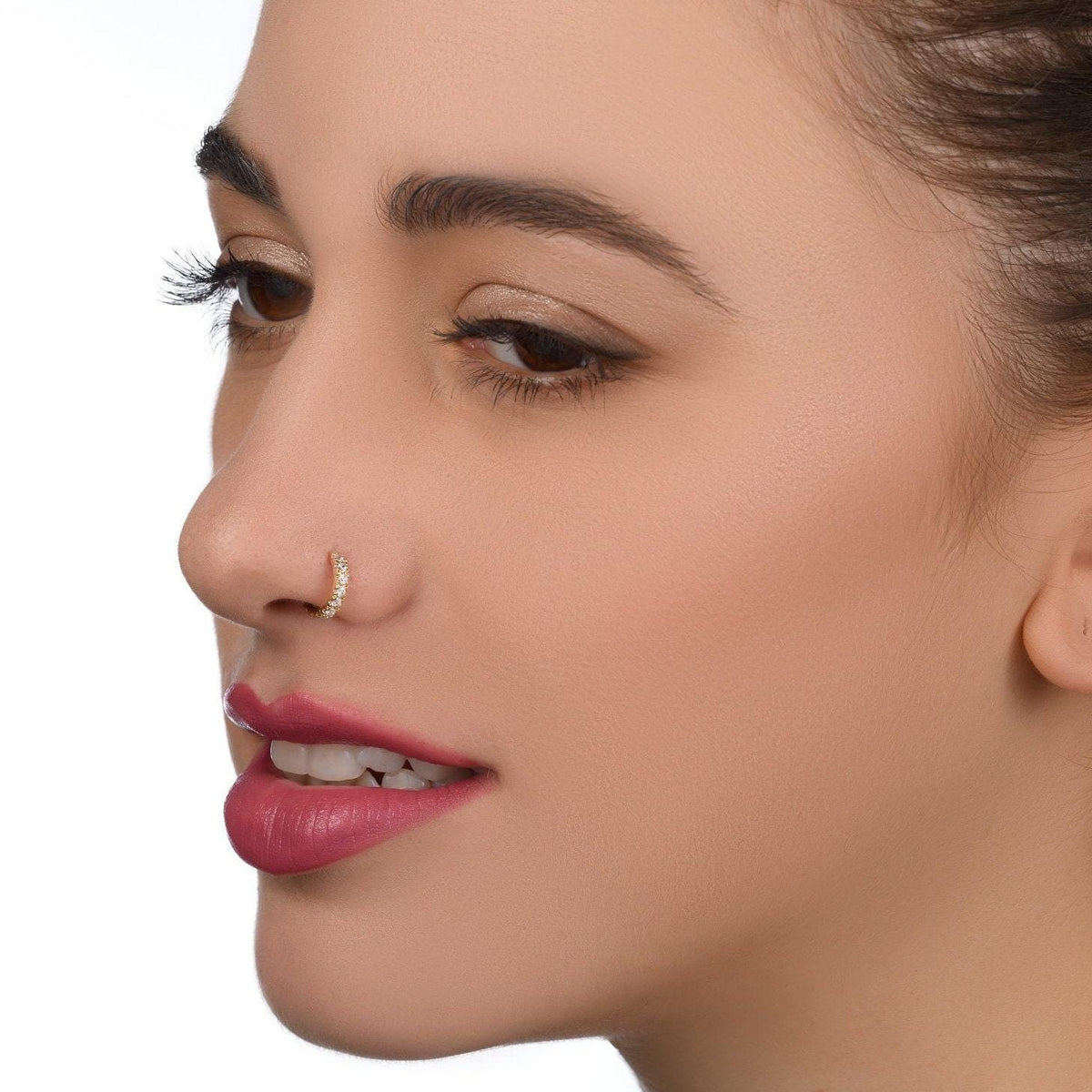 A close-up of a woman's face, focusing on her lips and nose.