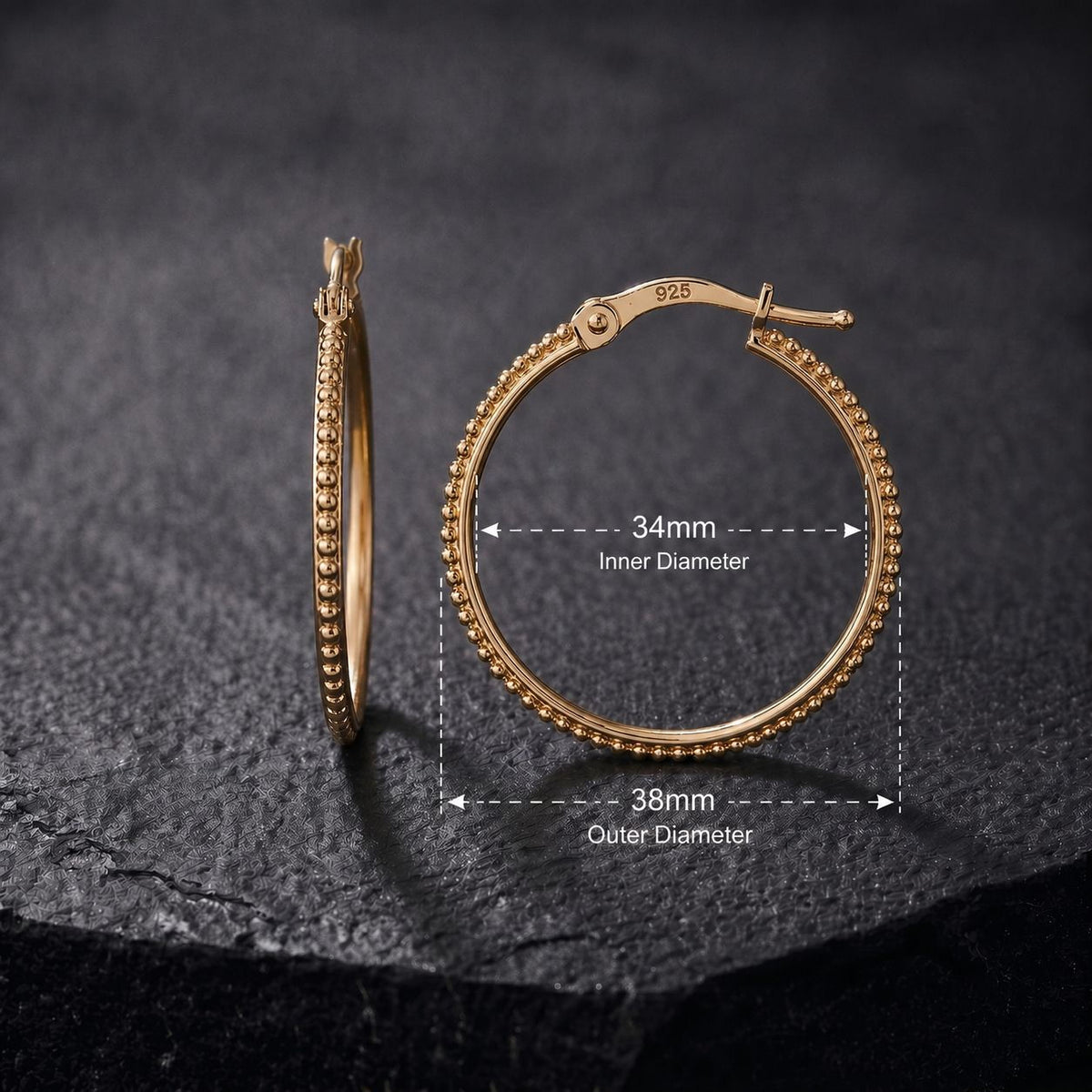a pair of gold-colored earrings with measurements and text indicating the inner and outer diameters.