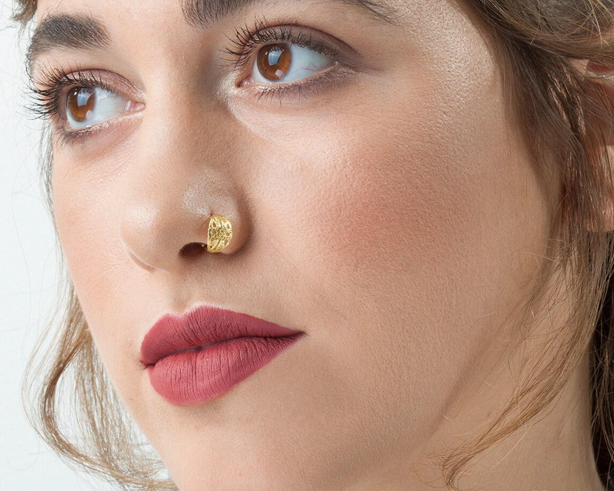 Nose Ring: A close-up of a woman's face, focusing on her lips and nose.