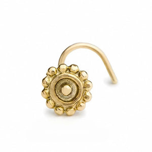 A gold-colored nose ring with a decorative design, accompanied by a measurement scale indicating its length.