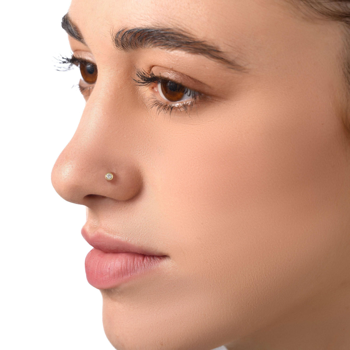 A close-up of a woman's face, focusing on her nose and lips.