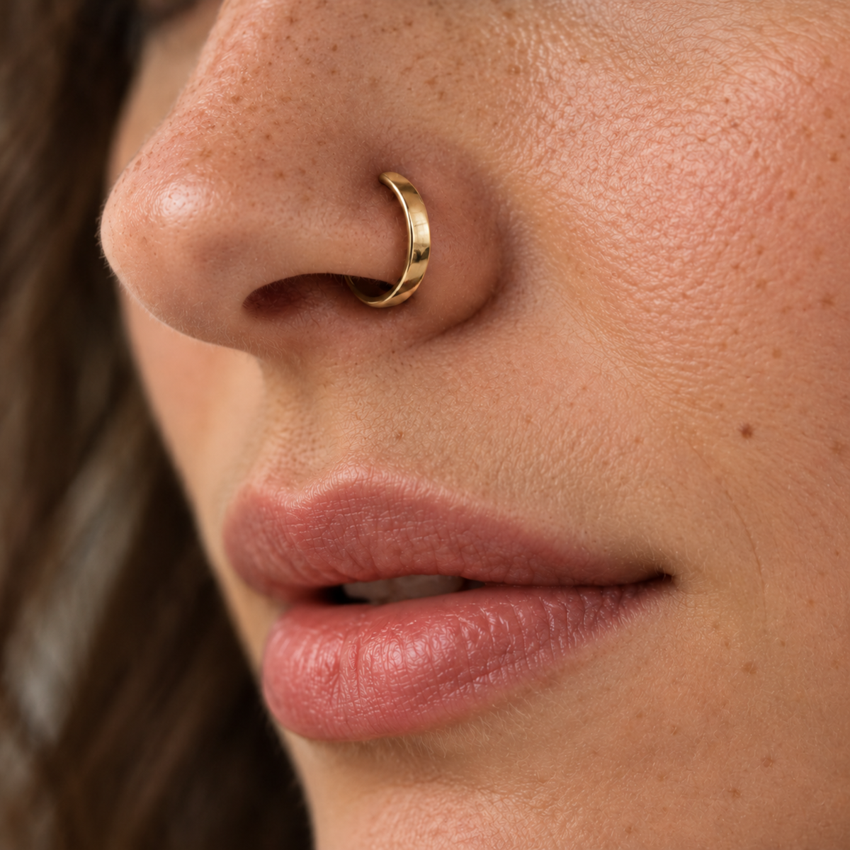 A close-up of a person's face, focusing on their lips and nose.