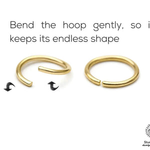two gold hoop earrings, one bent gently and the other straight, demonstrating how to bend the hoop to maintain its shape.