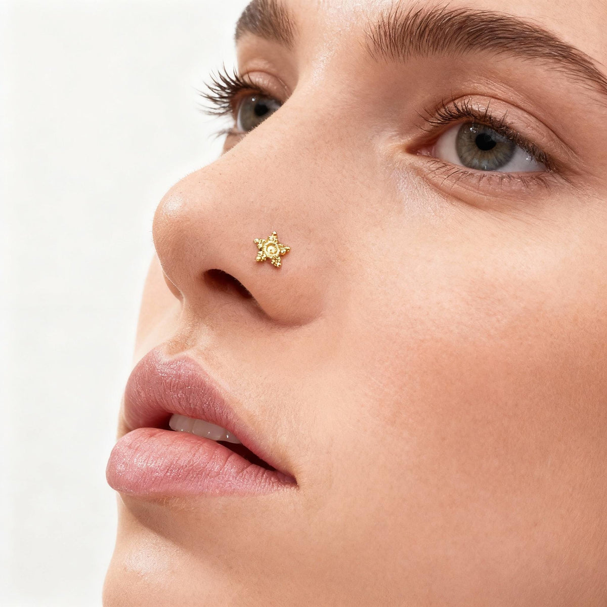 A close-up of a woman's face, focusing on her nose and upper lip.