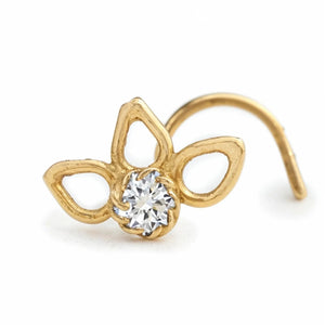A gold-colored nose ring with a clear gemstone in the center.
