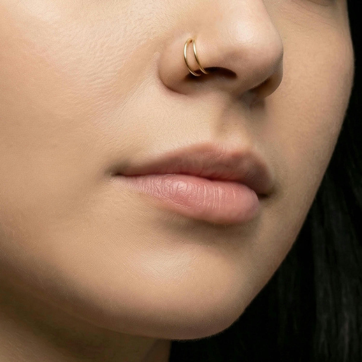 A close-up of a person's face, focusing on their nose and lips.