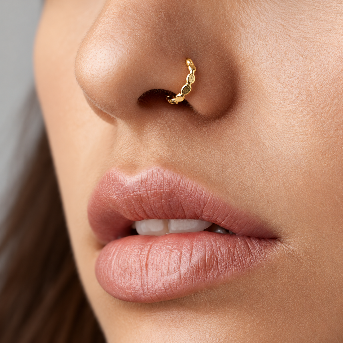 A close-up of a person's face, focusing on their lips and nose.
