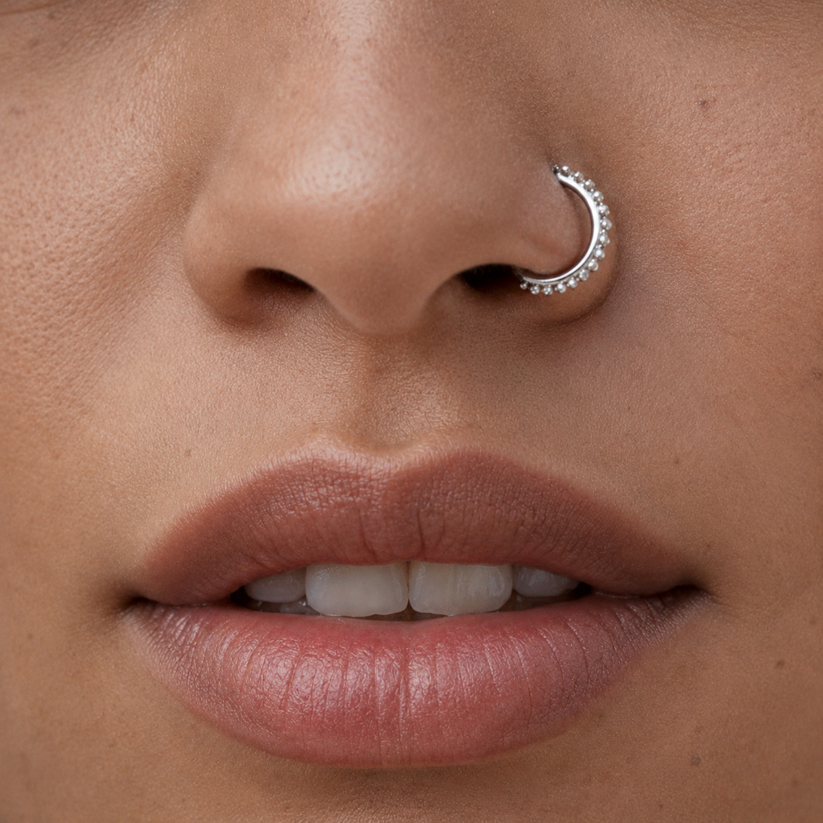 A close-up of a person's face, focusing on their lips and nose.