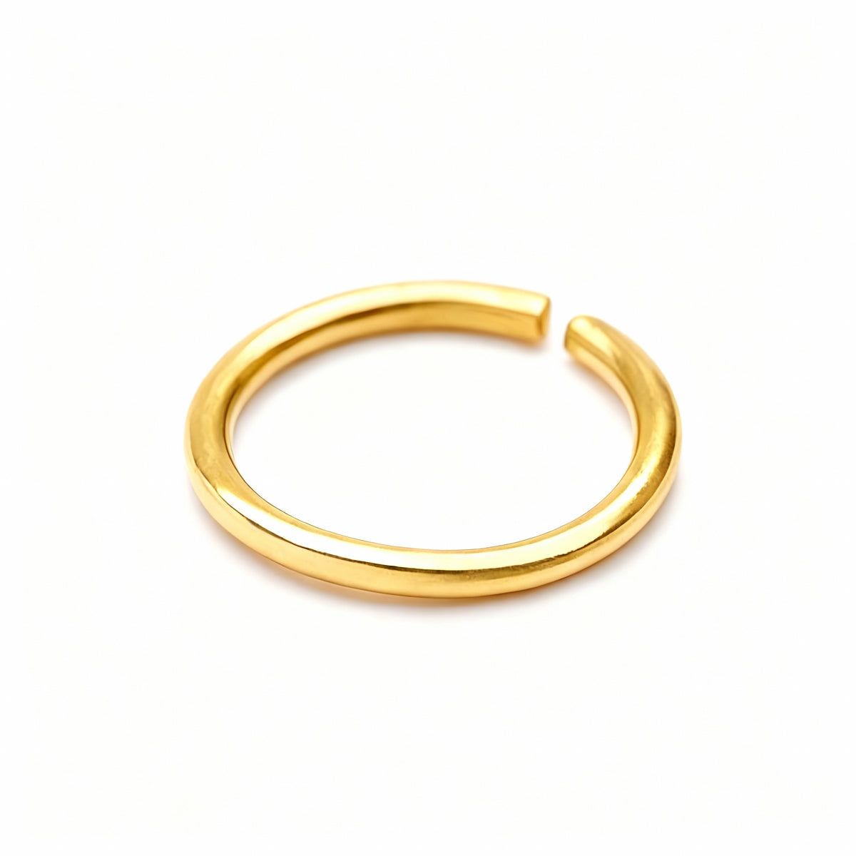 A gold ring with a curved band is shown against a white background.
