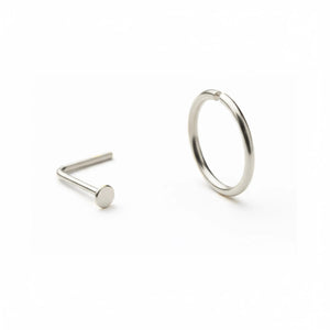 a silver-colored nose ring and a silver-colored ring on a white background.