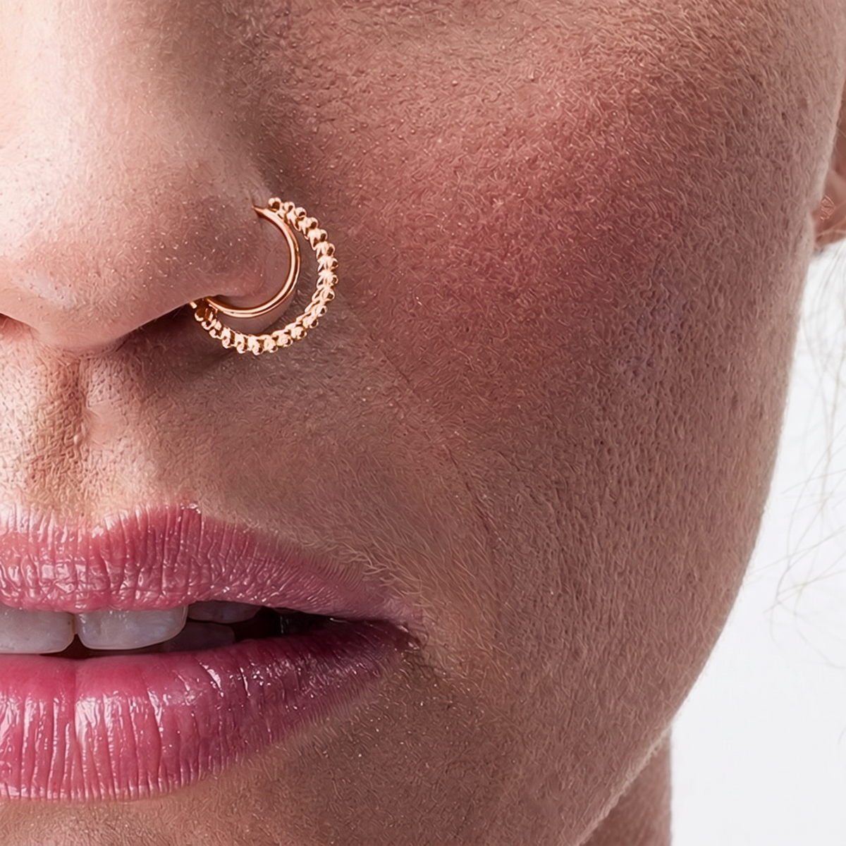 A close-up of a person's face, focusing on their nose and lips.