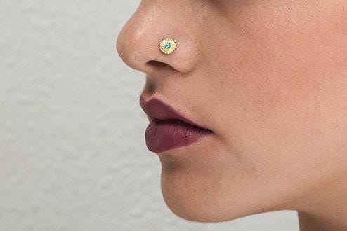 A close-up of a person's face, focusing on their nose and lips.